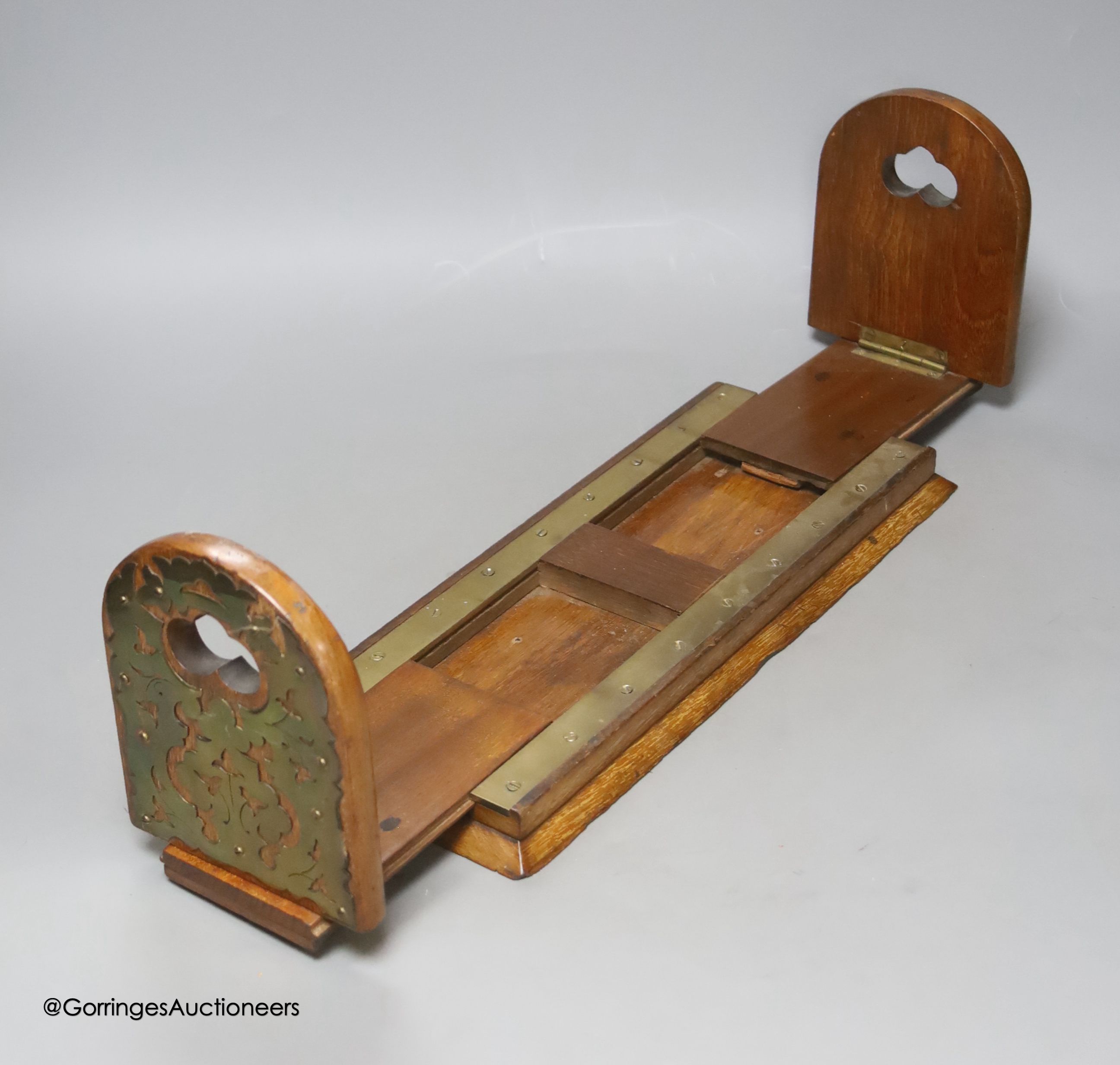 A Victorian mahogany and brass mounted book rest